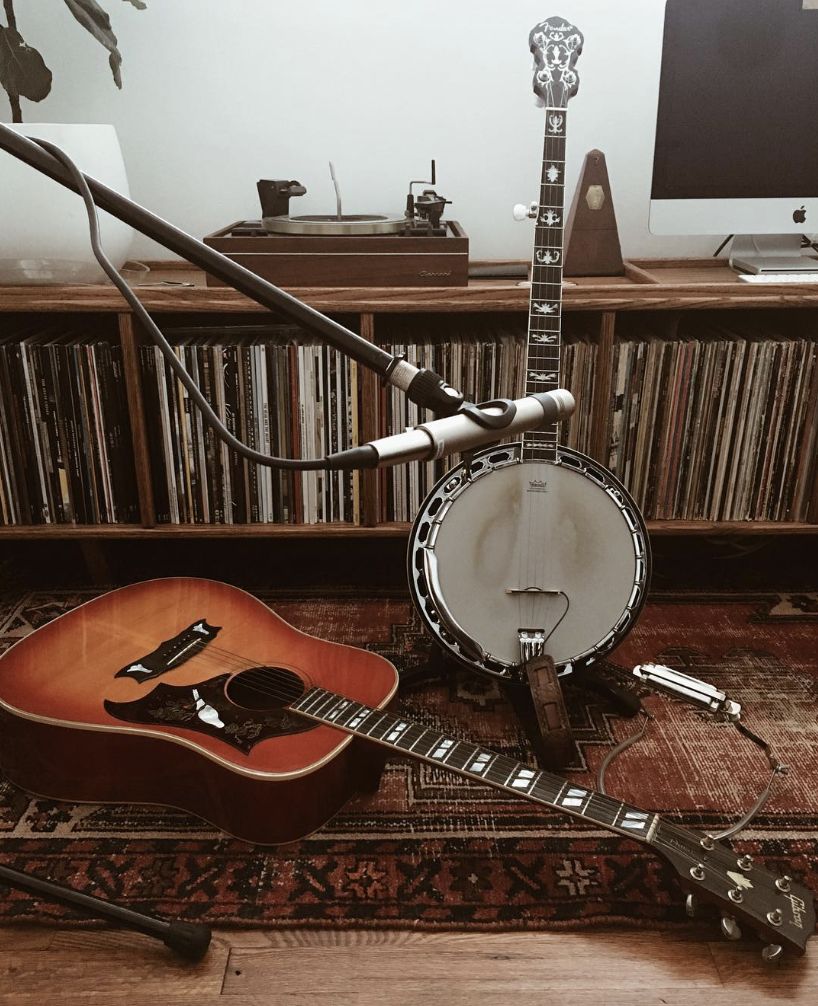 Guitar, banjo, and vinyl records in Silver Horse's studio